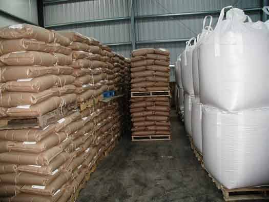 Black pepper packed in bags and big bags stacked in an export warehouse Black pepper packed in bags and big bags stacked in an export warehouse